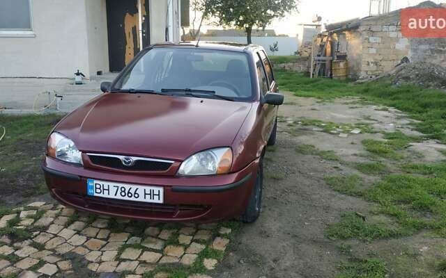 Красный Мазда 121, объемом двигателя 1.3 л и пробегом 185 тыс. км за 1850 $, фото 7 на Automoto.ua