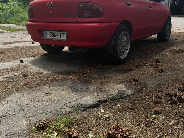 Красный Мазда 121, объемом двигателя 1.3 л и пробегом 333 тыс. км за 1650 $, фото 2 на Automoto.ua