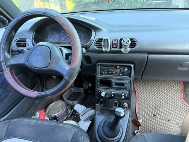 Синий Мазда 121, объемом двигателя 1.2 л и пробегом 2 тыс. км за 671 $, фото 3 на Automoto.ua
