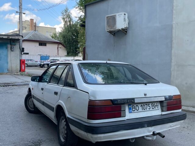 Белый Мазда 2, объемом двигателя 1.6 л и пробегом 356 тыс. км за 550 $, фото 1 на Automoto.ua