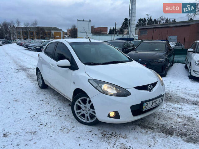 Білий Мазда 2, об'ємом двигуна 1.5 л та пробігом 170 тис. км за 5800 $, фото 1 на Automoto.ua