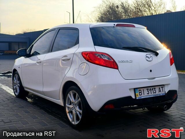 Білий Мазда 2, об'ємом двигуна 1.5 л та пробігом 170 тис. км за 5300 $, фото 2 на Automoto.ua