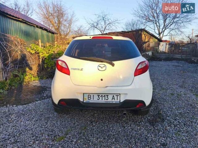 Білий Мазда 2, об'ємом двигуна 1.5 л та пробігом 165 тис. км за 5550 $, фото 2 на Automoto.ua