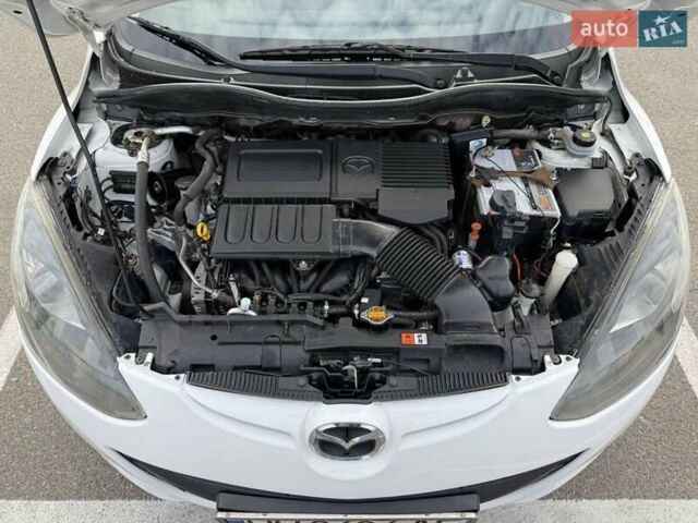 Білий Мазда 2, об'ємом двигуна 1.5 л та пробігом 135 тис. км за 7654 $, фото 17 на Automoto.ua