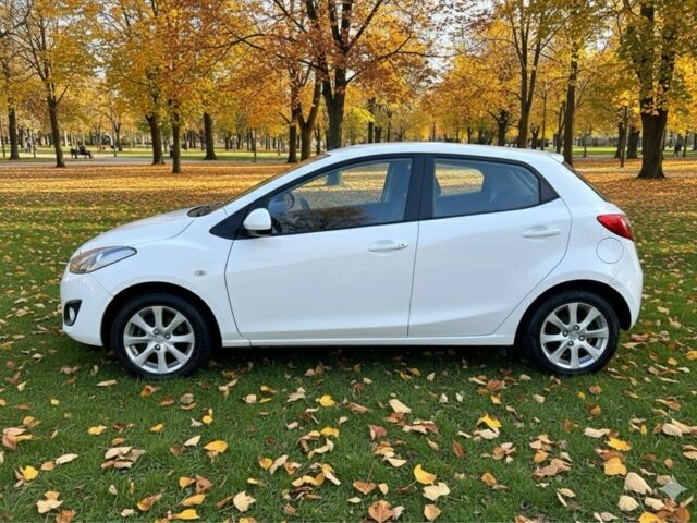 Білий Мазда 2, об'ємом двигуна 1.5 л та пробігом 139 тис. км за 5900 $, фото 1 на Automoto.ua