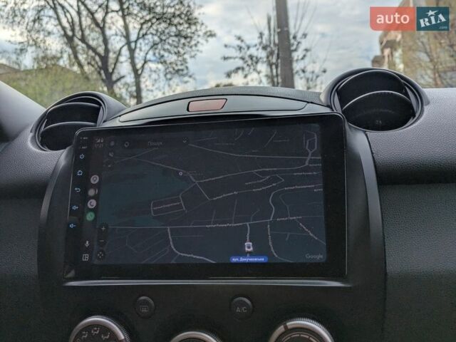 Белый Мазда 2, объемом двигателя 1.5 л и пробегом 194 тыс. км за 8700 $, фото 1 на Automoto.ua