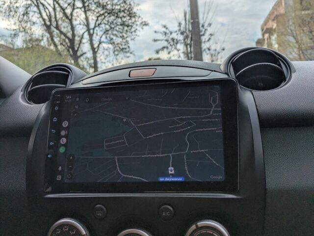 Білий Мазда 2, об'ємом двигуна 1.5 л та пробігом 194 тис. км за 8700 $, фото 1 на Automoto.ua