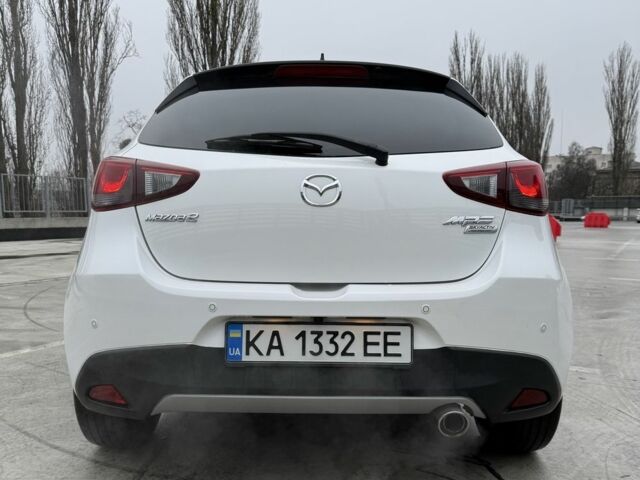 Белый Мазда 2, объемом двигателя 1.5 л и пробегом 75 тыс. км за 273 $, фото 6 на Automoto.ua