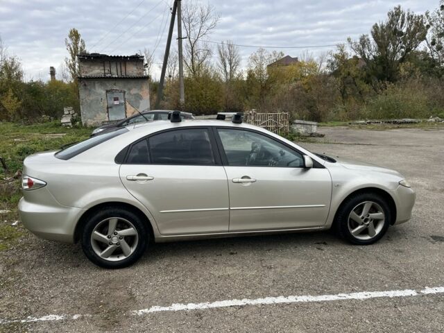 Бежевый Мазда 2, объемом двигателя 2 л и пробегом 310 тыс. км за 3200 $, фото 1 на Automoto.ua