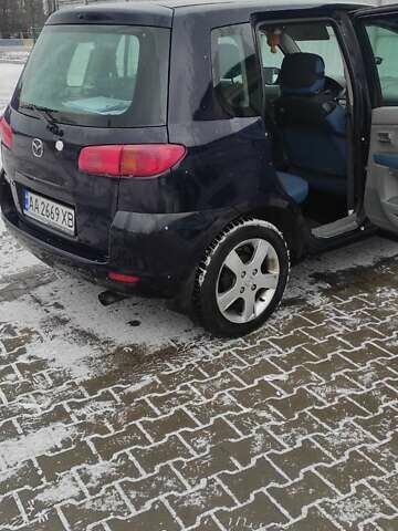 Чорний Мазда 2, об'ємом двигуна 1.4 л та пробігом 262 тис. км за 4485 $, фото 1 на Automoto.ua