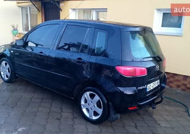 Черный Мазда 2, объемом двигателя 1.4 л и пробегом 237 тыс. км за 4300 $, фото 1 на Automoto.ua