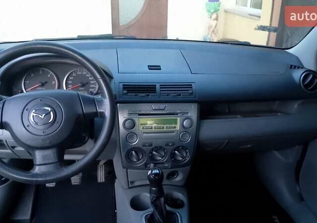 Черный Мазда 2, объемом двигателя 1.4 л и пробегом 237 тыс. км за 4300 $, фото 4 на Automoto.ua