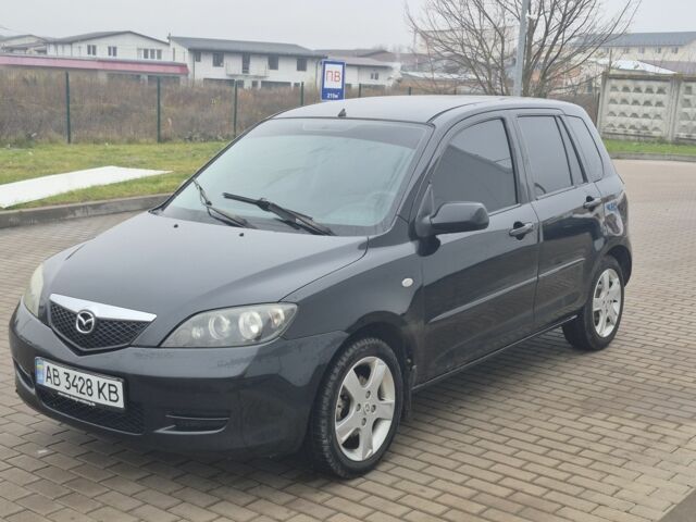 Черный Мазда 2, объемом двигателя 1.4 л и пробегом 240 тыс. км за 3500 $, фото 1 на Automoto.ua