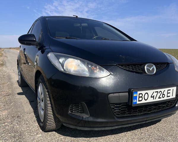 Черный Мазда 2, объемом двигателя 1.3 л и пробегом 250 тыс. км за 4200 $, фото 1 на Automoto.ua