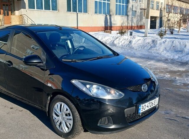 Черный Мазда 2, объемом двигателя 1.3 л и пробегом 260 тыс. км за 4450 $, фото 1 на Automoto.ua