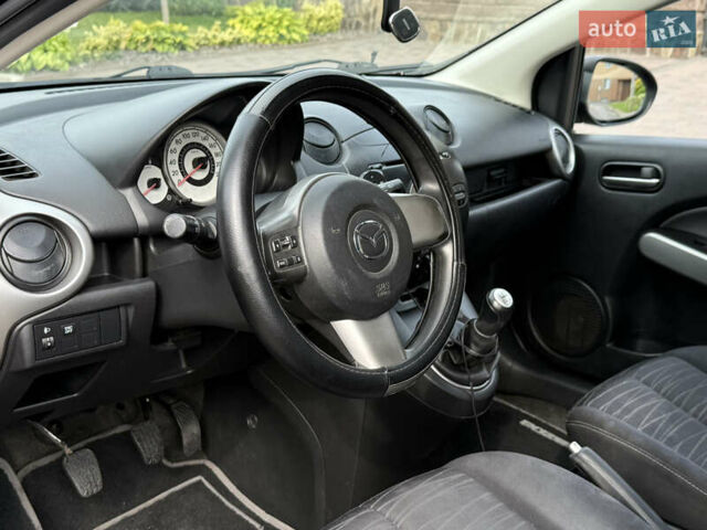Чорний Мазда 2, об'ємом двигуна 1.35 л та пробігом 197 тис. км за 4997 $, фото 10 на Automoto.ua