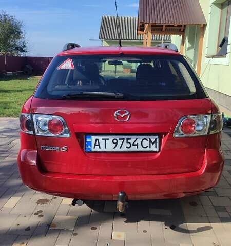 Красный Мазда 2, объемом двигателя 2 л и пробегом 265 тыс. км за 3650 $, фото 4 на Automoto.ua