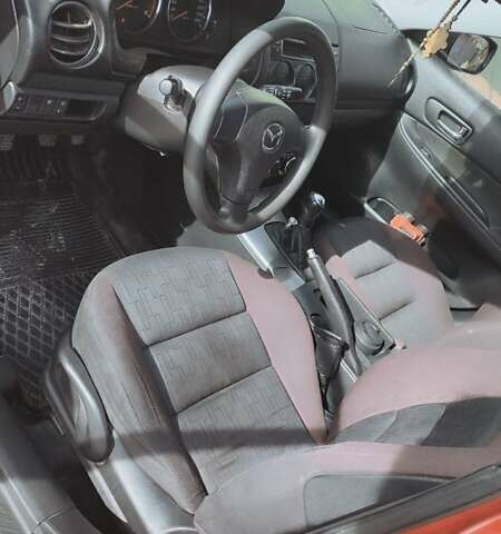 Красный Мазда 2, объемом двигателя 2 л и пробегом 265 тыс. км за 3650 $, фото 2 на Automoto.ua