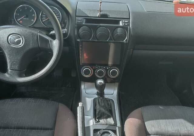 Красный Мазда 2, объемом двигателя 2 л и пробегом 265 тыс. км за 3650 $, фото 3 на Automoto.ua