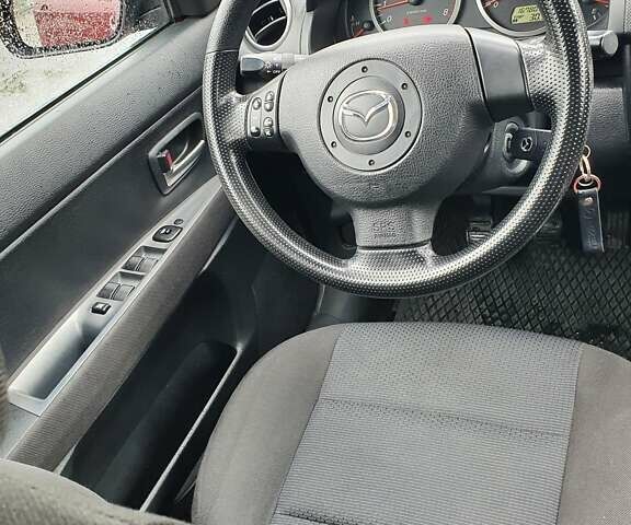 Червоний Мазда 2, об'ємом двигуна 1.4 л та пробігом 170 тис. км за 4200 $, фото 3 на Automoto.ua