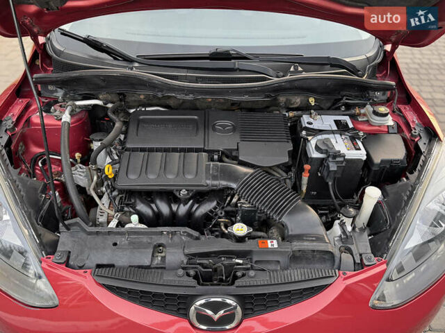 Червоний Мазда 2, об'ємом двигуна 1.5 л та пробігом 138 тис. км за 6800 $, фото 48 на Automoto.ua