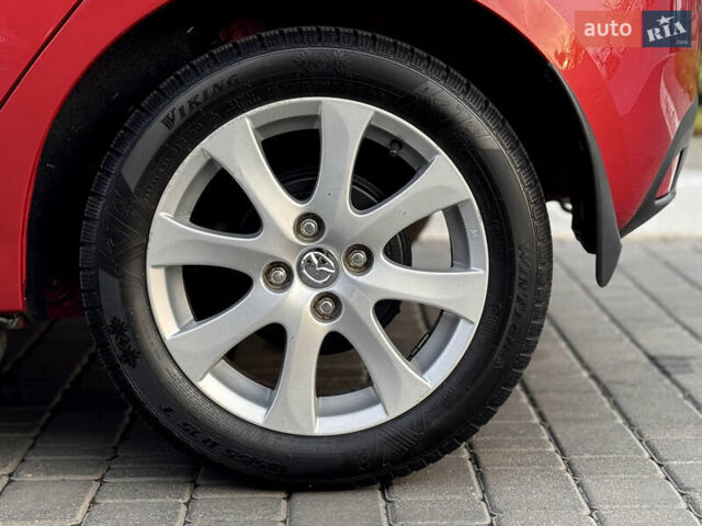 Червоний Мазда 2, об'ємом двигуна 1.5 л та пробігом 138 тис. км за 6800 $, фото 37 на Automoto.ua