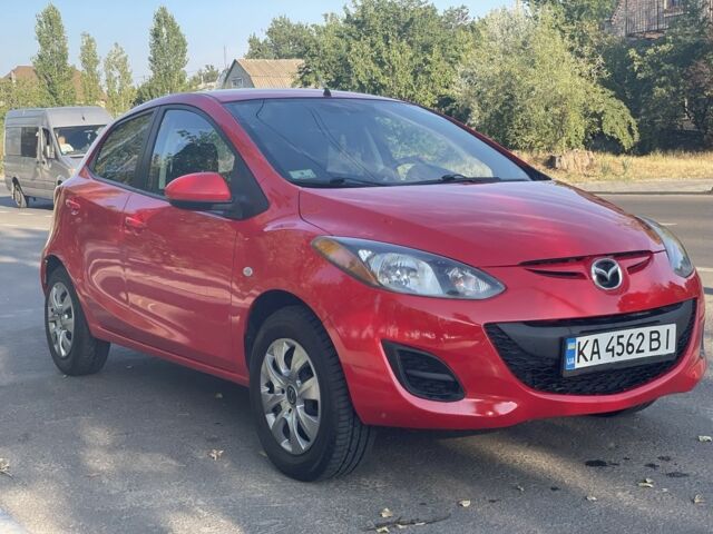 Красный Мазда 2, объемом двигателя 1.5 л и пробегом 90 тыс. км за 6599 $, фото 1 на Automoto.ua