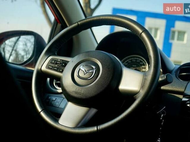 Красный Мазда 2, объемом двигателя 1.3 л и пробегом 130 тыс. км за 5400 $, фото 10 на Automoto.ua