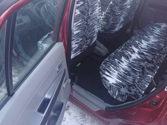 Красный Мазда 2, объемом двигателя 1.3 л и пробегом 164 тыс. км за 3500 $, фото 2 на Automoto.ua