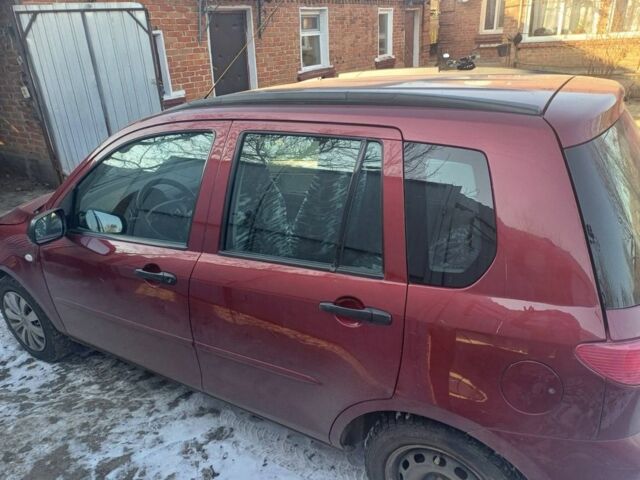 Красный Мазда 2, объемом двигателя 1.3 л и пробегом 164 тыс. км за 3500 $, фото 1 на Automoto.ua