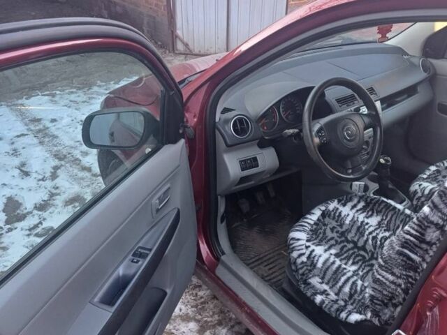 Красный Мазда 2, объемом двигателя 1.3 л и пробегом 164 тыс. км за 3500 $, фото 5 на Automoto.ua