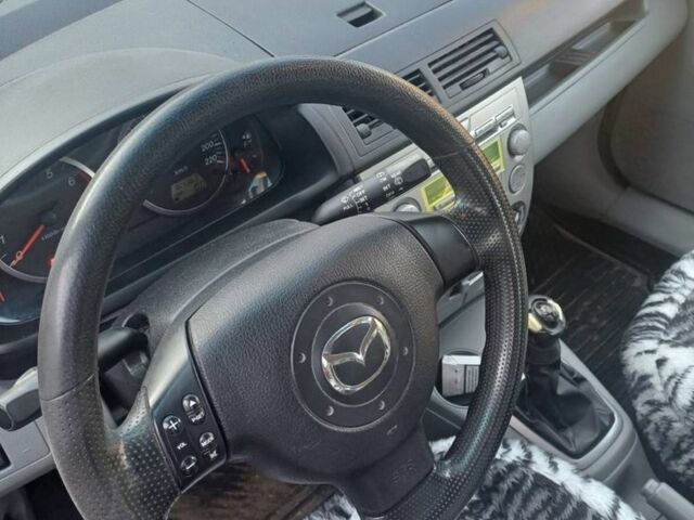 Красный Мазда 2, объемом двигателя 1.3 л и пробегом 164 тыс. км за 3500 $, фото 3 на Automoto.ua