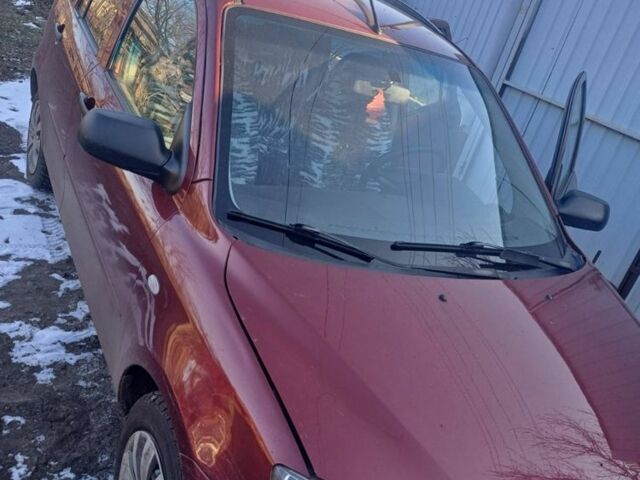 Красный Мазда 2, объемом двигателя 1.3 л и пробегом 164 тыс. км за 3500 $, фото 4 на Automoto.ua