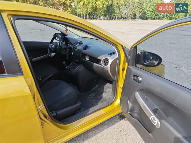 Жовтий Мазда 2, об'ємом двигуна 1.5 л та пробігом 74 тис. км за 5600 $, фото 10 на Automoto.ua