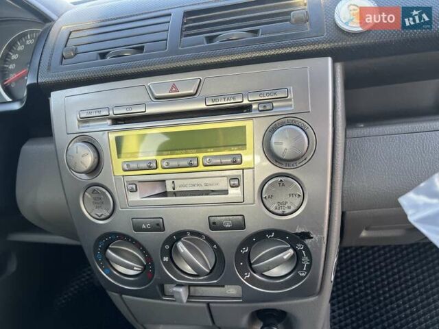 Серый Мазда 2, объемом двигателя 1.39 л и пробегом 120 тыс. км за 2999 $, фото 5 на Automoto.ua