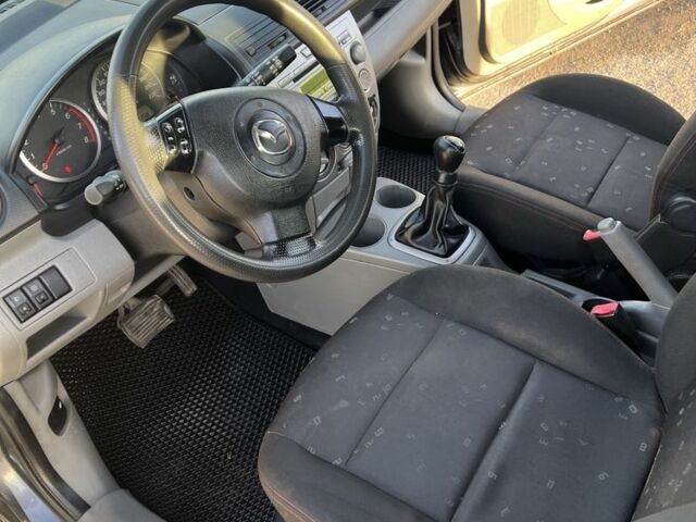 Серый Мазда 2, объемом двигателя 1.4 л и пробегом 120 тыс. км за 2999 $, фото 4 на Automoto.ua