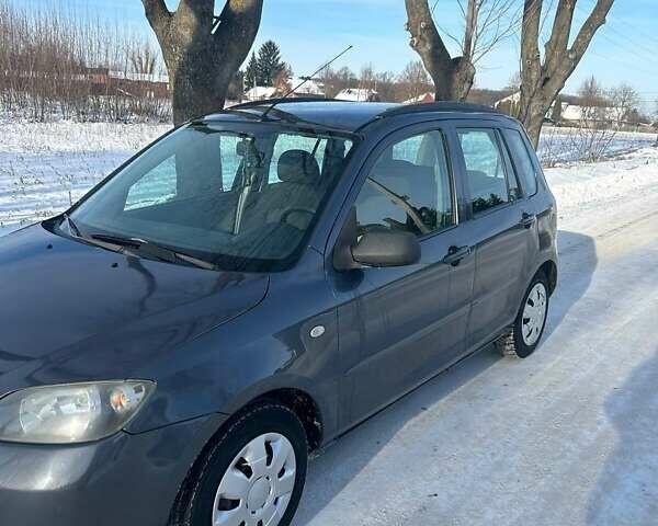 Сірий Мазда 2, об'ємом двигуна 1.39 л та пробігом 150 тис. км за 3400 $, фото 6 на Automoto.ua