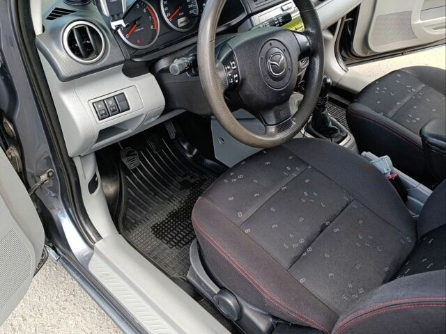 Сірий Мазда 2, об'ємом двигуна 1.4 л та пробігом 304 тис. км за 3200 $, фото 7 на Automoto.ua