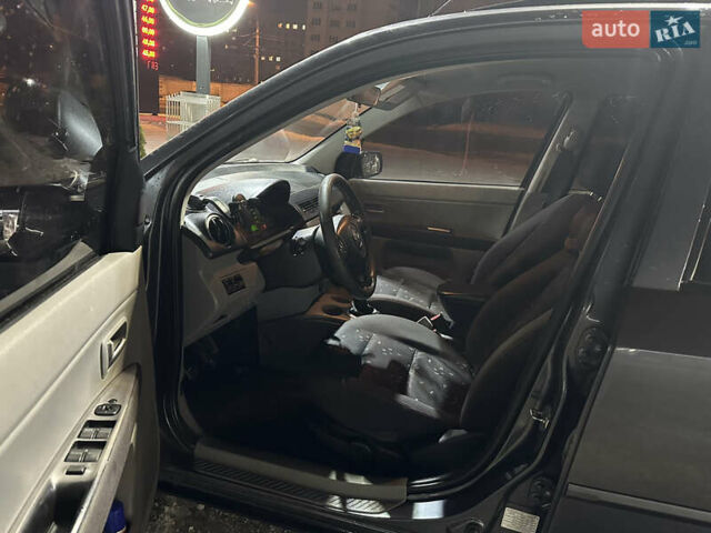 Сірий Мазда 2, об'ємом двигуна 1.4 л та пробігом 260 тис. км за 3900 $, фото 5 на Automoto.ua