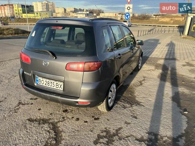 Серый Мазда 2, объемом двигателя 1.39 л и пробегом 120 тыс. км за 2999 $, фото 1 на Automoto.ua