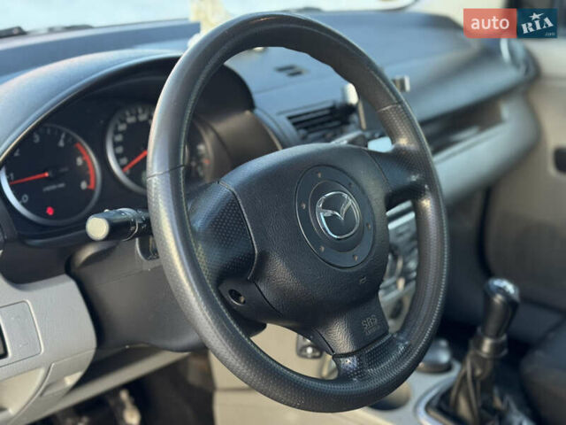 Сірий Мазда 2, об'ємом двигуна 1.4 л та пробігом 254 тис. км за 3500 $, фото 8 на Automoto.ua