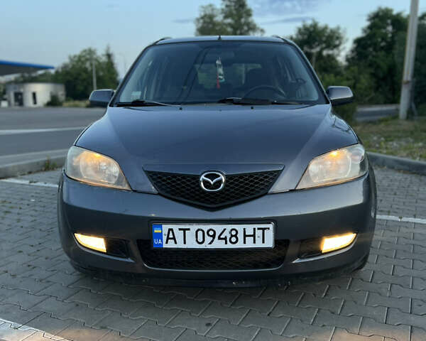 Серый Мазда 2, объемом двигателя 1.39 л и пробегом 220 тыс. км за 3750 $, фото 1 на Automoto.ua