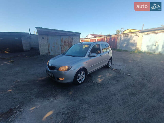 Сірий Мазда 2, об'ємом двигуна 1.4 л та пробігом 245 тис. км за 1399 $, фото 5 на Automoto.ua