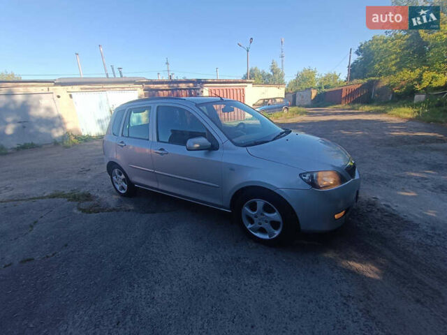 Сірий Мазда 2, об'ємом двигуна 1.4 л та пробігом 245 тис. км за 1399 $, фото 1 на Automoto.ua