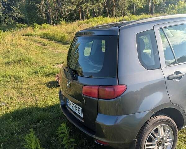 Серый Мазда 2, объемом двигателя 1.4 л и пробегом 187 тыс. км за 5500 $, фото 1 на Automoto.ua