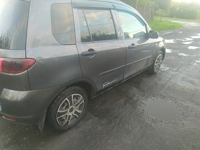 Сірий Мазда 2, об'ємом двигуна 1.4 л та пробігом 12 тис. км за 2506 $, фото 3 на Automoto.ua