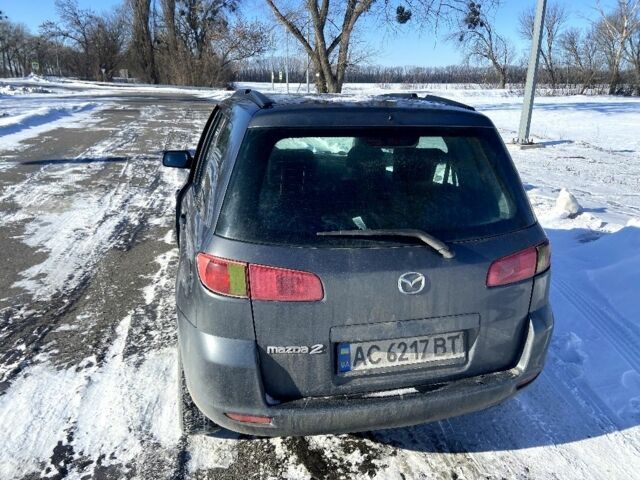 Сірий Мазда 2, об'ємом двигуна 1.4 л та пробігом 253 тис. км за 3300 $, фото 4 на Automoto.ua