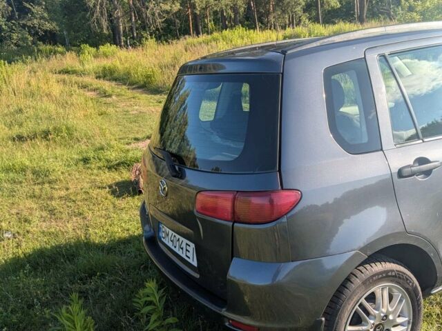 Серый Мазда 2, объемом двигателя 1.4 л и пробегом 187 тыс. км за 5500 $, фото 1 на Automoto.ua