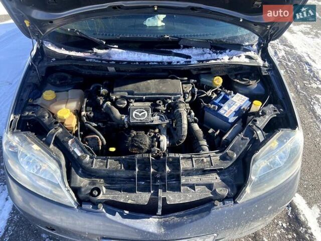 Серый Мазда 2, объемом двигателя 1.4 л и пробегом 253 тыс. км за 3300 $, фото 23 на Automoto.ua