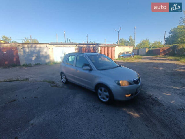 Сірий Мазда 2, об'ємом двигуна 1.4 л та пробігом 245 тис. км за 1399 $, фото 4 на Automoto.ua